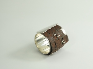 Dominique Bréchault, "Exhausted". Ring, 2014. Silver, found muffler part. Fabricated.