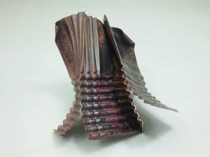 D. Brechault, Zip No. 5, brooch, copper, heat patina,; corrugation, fold-forming.